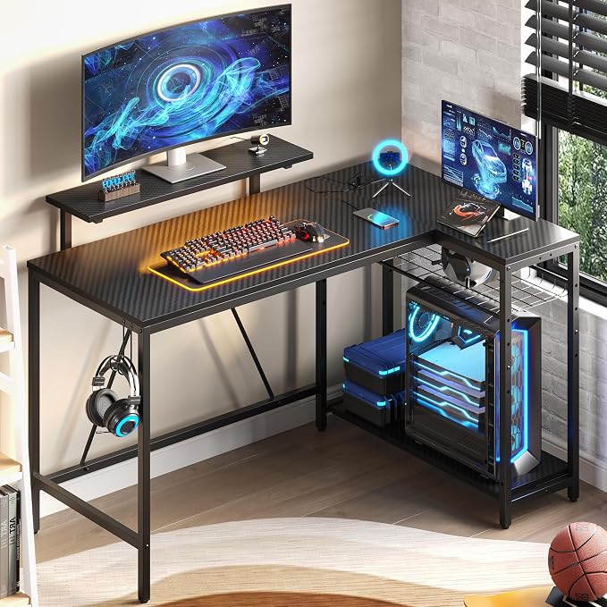 Bestier 52-Inch L-Shaped Gaming Desk with Charging & LED, Black | Charging 3AC+2USB, RGB LED 20 Colors/22 Modes, Reversible Shelves, Carbon Fiber Texture, Headphone Hook, 52 in